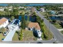 Aerial view showcasing a house near the water, with a camper and neighboring properties visible at 3306 Holly Springs Dr, Hernando Beach, FL 34607