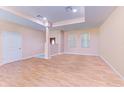 Empty living room with light walls and wood floors at 397 Doniphan Dr, Port Charlotte, FL 33954