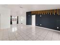 Open living room featuring tiled floors at 9102 Post Oak Ct, Tampa, FL 33615