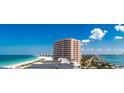 An elegant condo building offers stunning beach views and a luxurious beachfront living experience at 1390 Gulf Blvd # 1204, Clearwater, FL 33767