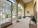 Cozy screened porch with a wooden bench and view of the backyard at 2915 126Th E Ter, Parrish, FL 34219