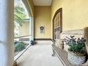 Relaxing screened porch with a rustic bench and decorative accents at 2915 126Th E Ter, Parrish, FL 34219