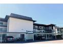 Exterior view of a condo building with parking at 4660 Marine Pkwy # 202, New Port Richey, FL 34652