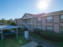 Two-story condo building with parking and landscaping at 4805 Sunnybrook Dr # 21, New Port Richey, FL 34653