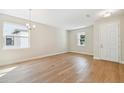 Bright dining room with hardwood floors and chandelier at 5825 1/2 S 5Th St, Tampa, FL 33611