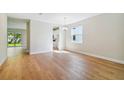 Dining room with hardwood floors, access to kitchen and backyard at 5825 1/2 S 5Th St, Tampa, FL 33611