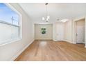 Bright dining room with hardwood floors and chandelier at 5825 1/2 S 5Th St, Tampa, FL 33611