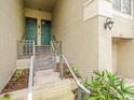Townhouse entry with teal doors and gray stone steps at 760 Coral Reef Dr, Tampa, FL 33602