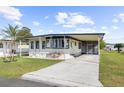 Single-Gathering home with carport and landscaped yard at 35209 Ada Ave, Zephyrhills, FL 33541