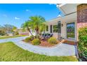 Charming home with manicured lawn, mature palms, and welcoming front entrance at 11211 60Th Ave, Seminole, FL 33772