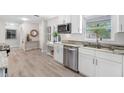 Modern kitchen featuring granite countertops, stainless steel appliances, and ample cabinet space at 11211 60Th Ave, Seminole, FL 33772