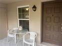 Condo entryway features a small table and chairs at 2998 Bonaventure Cir # 101, Palm Harbor, FL 34684