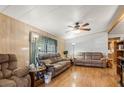 Living room with two sofas, wood floors and ceiling fan at 33821 Terrace Blvd, Wesley Chapel, FL 33543