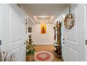 Bright entryway with hardwood floors and decorative accents at 795 Collany Rd # 304, St Petersburg, FL 33715
