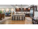 Spacious kitchen featuring granite countertops and dark wood cabinets at 795 Collany Rd # 304, St Petersburg, FL 33715