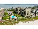 Beachfront condos with lush landscaping, private beach access, and a community pool at 1430 Gulf Blvd # 204, Clearwater Beach, FL 33767