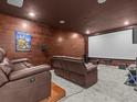 Finished basement with a home theater and comfortable seating at 19270 Briarbrook Dr, Tampa, FL 33647
