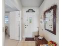 Bright entryway with mirror and console table at 2231 Utopian E Dr # 321, Clearwater, FL 33763