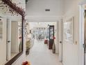 View through condo's entryway to living and dining areas at 2231 Utopian E Dr # 321, Clearwater, FL 33763