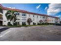 Exterior view of building with parking at 2700 Bayshore Blvd # 4304, Dunedin, FL 34698