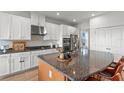Spacious kitchen with granite countertops, stainless steel appliances, and ample storage space at 33975 Astoria Cir, Wesley Chapel, FL 33545