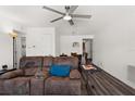 Living room with brown reclining sofas and ceiling fan at 7075 Lafayette N, Pinellas Park, FL 33781