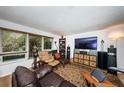 Relaxing living room with leather furniture and large TV at 1609 Lakeview Rd, Clearwater, FL 33756