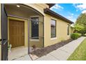 Inviting front entry with screened door and decorative accents at 5641 Sunset Falls Dr, Apollo Beach, FL 33572