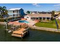 Waterfront property showcasing pool, dock, and boat access at 825 116Th Ave, Treasure Island, FL 33706