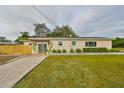 Charming single-story house with a well-manicured lawn and modern updates at 1161 Howard St, Clearwater, FL 33756