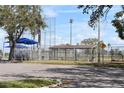 Baseball field featuring covered benches and spectator seating, perfect for enjoying community sports events at 446 Rotary Ne Pl, St Petersburg, FL 33703