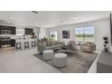 Bright, open-concept living area boasts modern finishes, neutral tones and great natural light with kitchen view at 10533 Hidden Banks Gln, Parrish, FL 34219