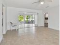 Bright living room with tile floors and sliding doors at 17255 2Nd E St, North Redington Beach, FL 33708