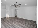 Open living area with gray vinyl flooring, recessed lighting and ceiling fan at 2292 Austrian Ln # 34, Clearwater, FL 33763