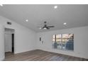Spacious living room with vinyl flooring and vaulted ceilings at 2292 Austrian Ln # 34, Clearwater, FL 33763