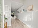 Bright and airy entryway with light wood floors and beach-themed decor at 231 21St Ave, St Pete Beach, FL 33706