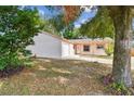 Charming one-story home with a brick exterior and mature trees at 503 Avocado Cir, Brandon, FL 33510