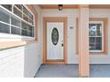 White front door with a decorative glass oval insert at 503 Avocado Cir, Brandon, FL 33510