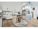 Open concept living area with hardwood floors and a neutral color palette at 1903 Gulf Beach Blvd, Tarpon Springs, FL 34689