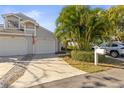 Two-car garage, mailbox, and neatly landscaped yard at 2458 Alhambra St, Clearwater, FL 33761