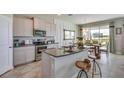 Modern kitchen with stainless steel appliances and granite countertops at 3530 Thistle Bank Ct, Plant City, FL 33565