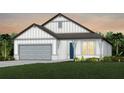 Charming house with gray siding, two-car garage, and well-manicured lawn at 36412 Sespe Creek Ct, Zephyrhills, FL 33540