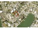 Aerial view showcasing the property's waterfront location and proximity to neighbors at 3863 Belle Vista E Dr, St Pete Beach, FL 33706