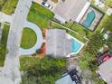 Aerial view of the home featuring a circular driveway and private pool area at 4659 Helena Ne St, St Petersburg, FL 33703