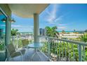 Balcony with ocean view, featuring seating and a table at 11605 Gulf Blvd # 507, Treasure Island, FL 33706