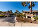Entrance to Villas de Golf community with signage and landscaping at 12300 Vonn Rd # 9205, Largo, FL 33774