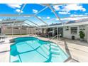 Relaxing pool area with a covered patio and plenty of space for lounging at 1308 Oakhill St, Seffner, FL 33584