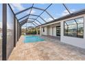 Relaxing screened-in pool and patio area at 15136 Hennipen Cir, Port Charlotte, FL 33981