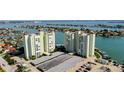 Drone view of two waterfront condo towers and parking at 400 64 Ave # 1207, St Pete Beach, FL 33706