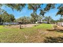 Large backyard with garden beds and a shed at 11305 Sweet Bay Ct, Riverview, FL 33569